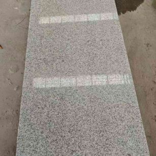 银川芝麻白光面毛板